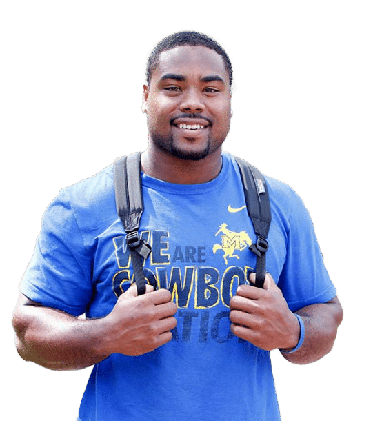 Smiling person wearing a blue shirt with cowboy logo and text, carrying a black backpack.